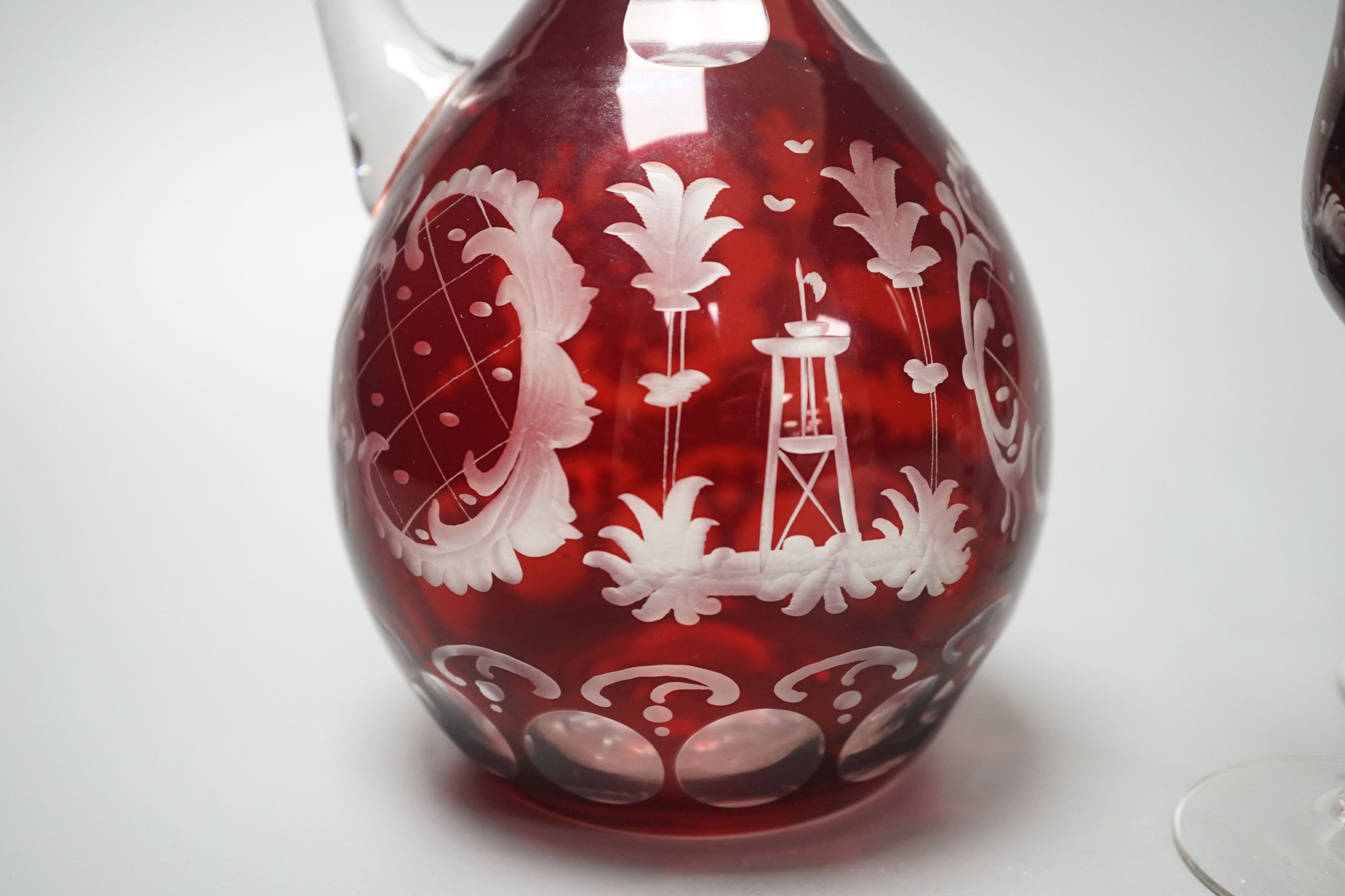 A Bohemian wheel engraved ruby flashed glass decanter and four matching liqueur glasses